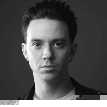 Black and white portrait of director Aiden T. Shaw.